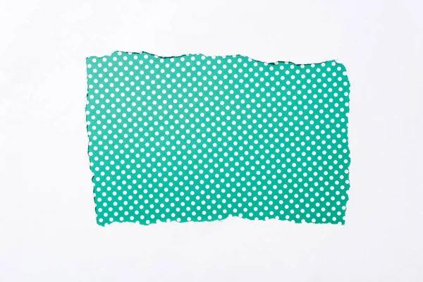 Polka dot green and white colorful background in white torn paper hole — Stock Photo