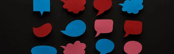 Panoramic shot of empty speech bubbles on black background, cyberbullying concept — Stock Photo