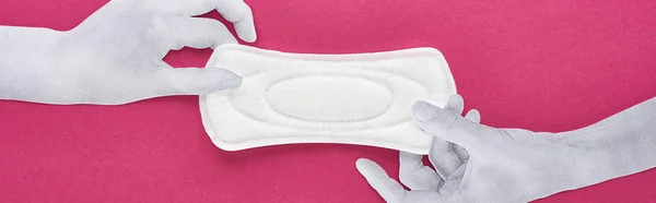 Top view of paper cut white hands and white sanitary napkin on purple background, panoramic shot — Stock Photo