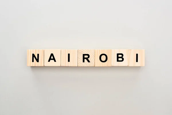 Top view of wooden blocks with Nairobi lettering on white background — Stock Photo