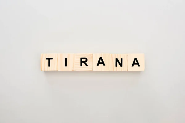 Top view of wooden blocks with Tirana lettering on white background — Stock Photo