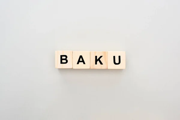 Top view of wooden blocks with Baku lettering on grey background — Stock Photo