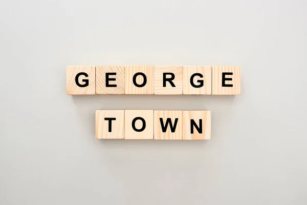 Top view of wooden blocks with Georgetown lettering on grey background — Stock Photo