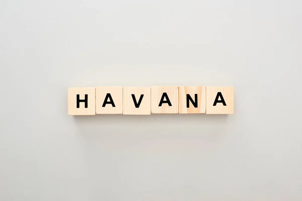 Top view of wooden blocks with Havana lettering on grey background — Stock Photo