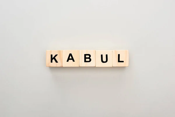 Top view of wooden blocks with Kabul lettering on grey background — Stock Photo