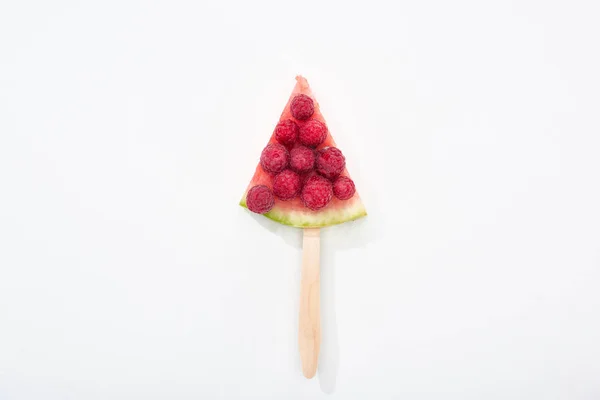 Top view of delicious watermelon on stick with raspberries on white background — Stock Photo