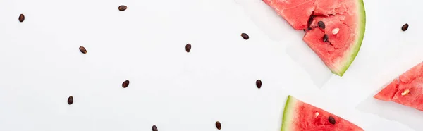 Panoramic shot of fresh watermelon slices with seeds on white background with copy space — Stock Photo
