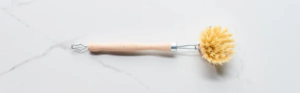 Panoramic shot of body brush on marble surface — Stock Photo