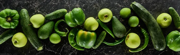 Panoramic shot of whole apples, limes, peppers, cucumbers, avocados and zucchini — Stock Photo
