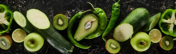 Panoramic shot of fresh apples, limes, peppers, avocado, kiwi and zucchini — Stock Photo