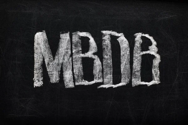 Top view of black chalk board with lettering MBDB — Stock Photo