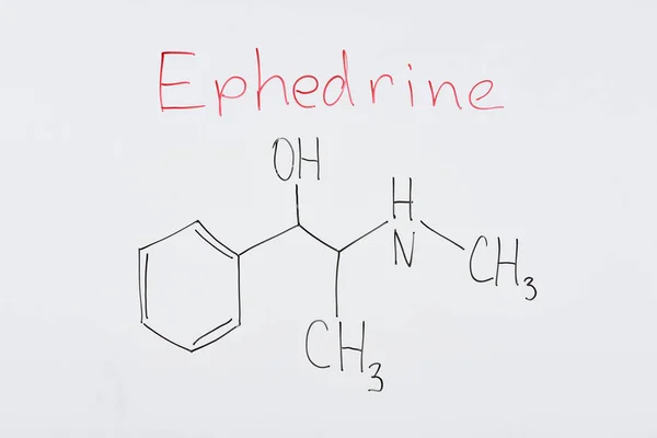 Top view of white board with chemical formula and lettering ephedrine — Stock Photo