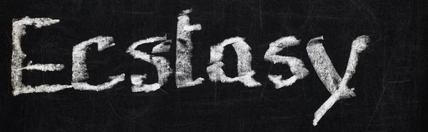 Panoramic shot of black chalk board with lettering ecstasy — Stock Photo