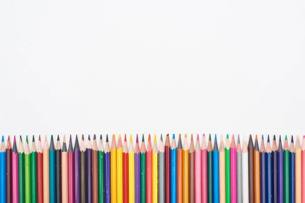 Straight line of color pencils isolated on white — Stock Photo