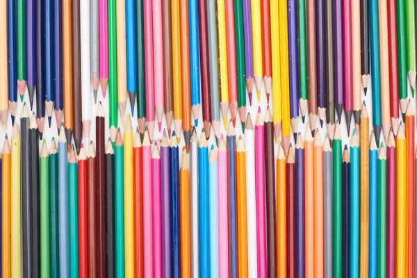 Two lines of different sizes sharpened color pencils — Stock Photo