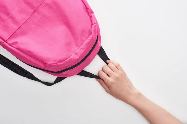 Studentessa tenendo brillante rosa schoolbag isolato su bianco — Foto stock