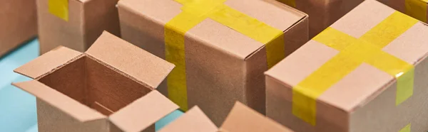 Panoramic view of miniature postal boxes with yellow adhesive tape — Stock Photo