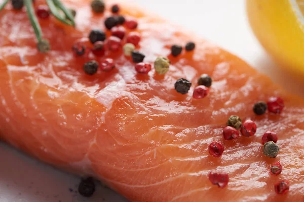 Close up view of uncooked fresh salmon with spicy pepper — Stock Photo