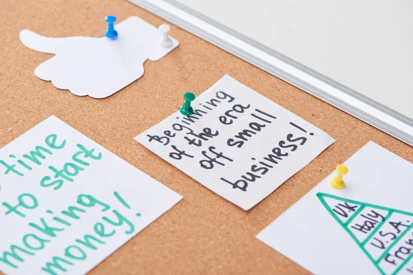 Cards with work notes and like sign pinned on cork office board — Stock Photo