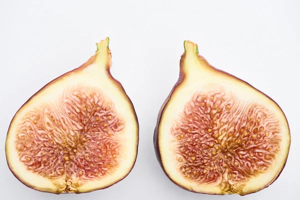 Ripe delicious fig halves on white background — Stock Photo