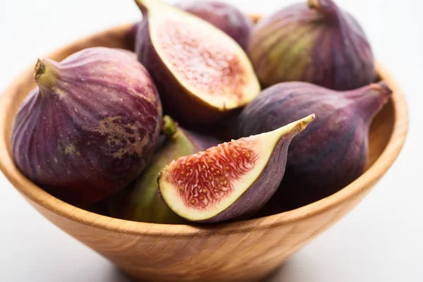 Close up view of ripe delicious figs in wooden bowl on white background — Stock Photo