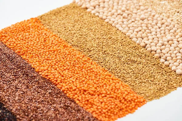 Buckwheat, red lentil and chickpea isolated on white — Stock Photo