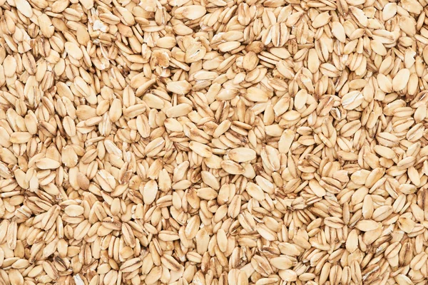 Top view of raw pressed organic oats — Stock Photo