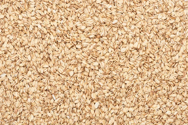 Top view of uncooked pressed organic oats — Stock Photo
