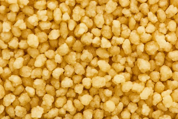 Vue rapprochée du couscous biologique brut — Photo de stock