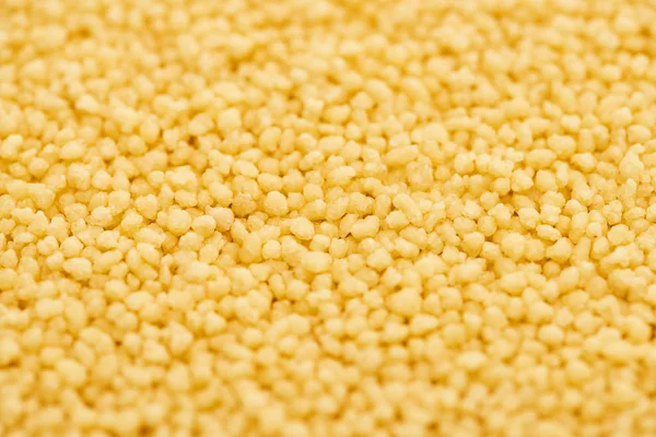 Close up view of raw organic couscous groat — Stock Photo