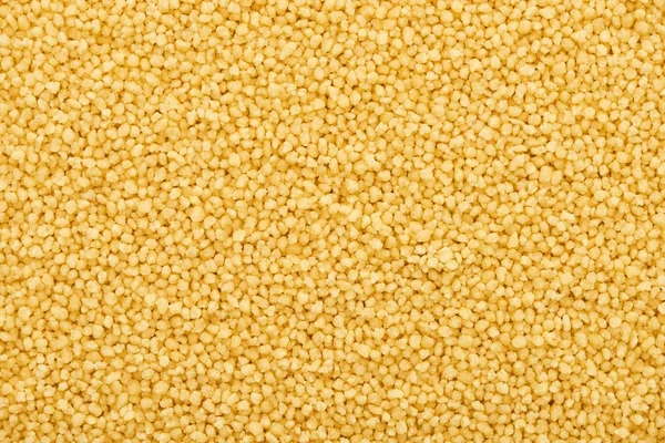 Top view of raw organic couscous groat — Stock Photo