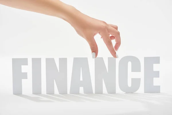 Cropped view of woman holding n letter on finance inscription on white background — Stock Photo