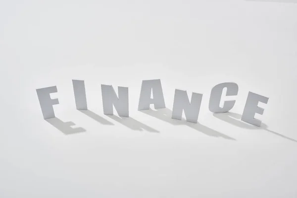 Finance lettering with shadows on white background — Stock Photo