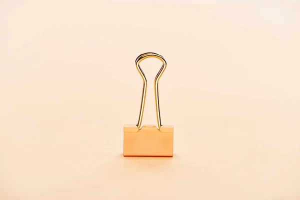 Paper clip on beige background with copy space — Stock Photo