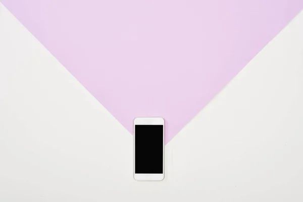 Top view  of smartphone with blank screen on violet and white background — Stock Photo