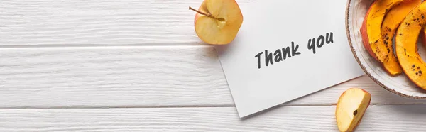 Top view of thank you card on wooden white table with apples and pumpkin, panoramic shot — Stock Photo