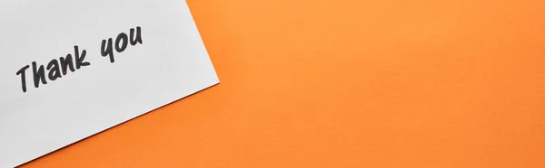 Top view of thank you card on orange background, panoramic shot — Stock Photo