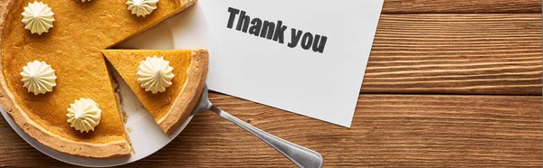 Top view of delicious pumpkin pie and thank you card on wooden table, panoramic shot — Stock Photo