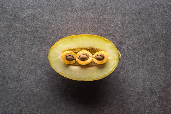 Top view of melon and apricots on grey background with copy space — Stock Photo