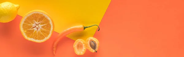 Top view of delicious fruits and vegetables on yellow and orange background with copy space, panoramic shot — Stock Photo