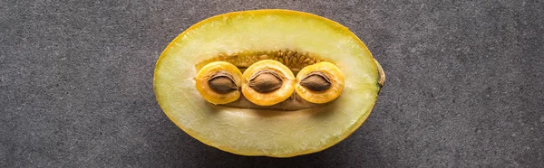 Top view of melon and apricots on grey background with copy space, panoramic shot — Stock Photo