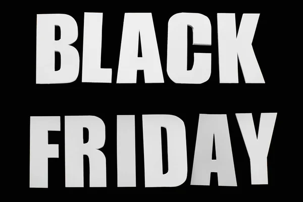 Draufsicht auf Black Friday Schriftzug isoliert auf Schwarz — Stockfoto