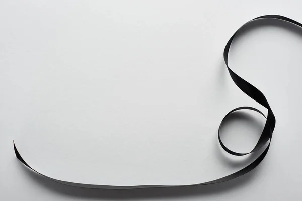 Top view of black ribbon on white background — Stock Photo
