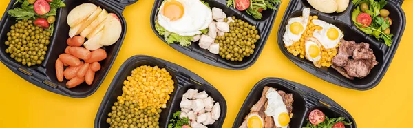 Panoramic shot of eco packages with vegetables, apples, meat, fried eggs and salads isolated on yellow — Stock Photo