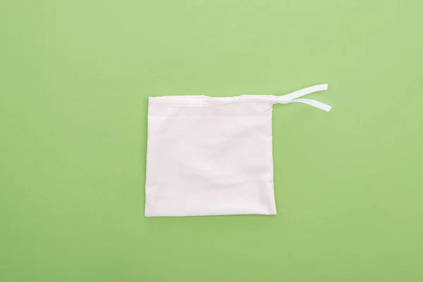 Top view of in eco friendly bag isolated on green — Stock Photo