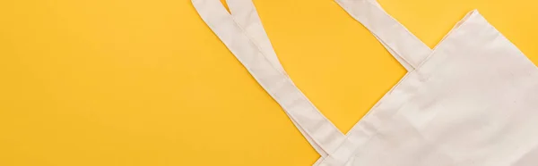 Top view of cotton eco friendly bag isolated on yellow, panoramic shot — Stock Photo