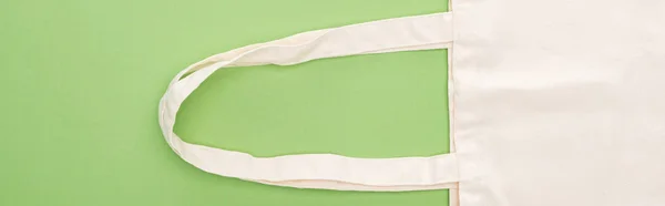 Top view of empty cotton eco bag isolated on green, panoramic shot — Stock Photo