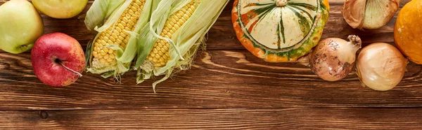 Top view of autumnal vegetables served on wooden table — Stock Photo