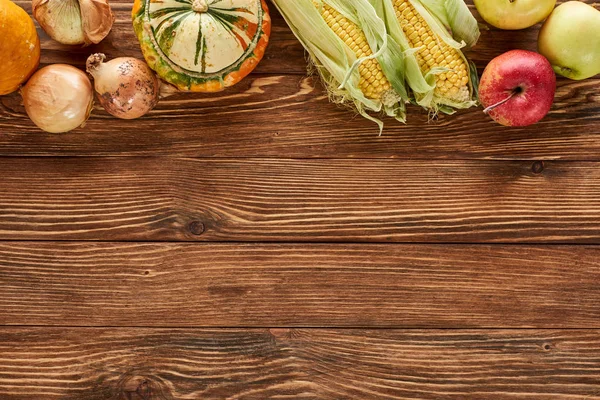 Top view of autumnal vegetables served on wooden table — Stock Photo