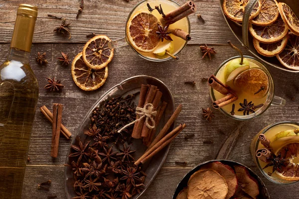Top view of traditional pear mulled wine and spices on wooden rustic table — Stock Photo